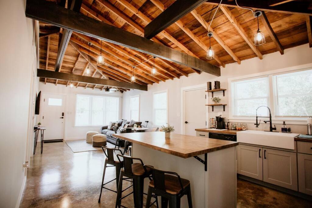 a kitchen with a large island in a room at The Turquoise Door Modern Rustic in Town of Lexington in Lexington