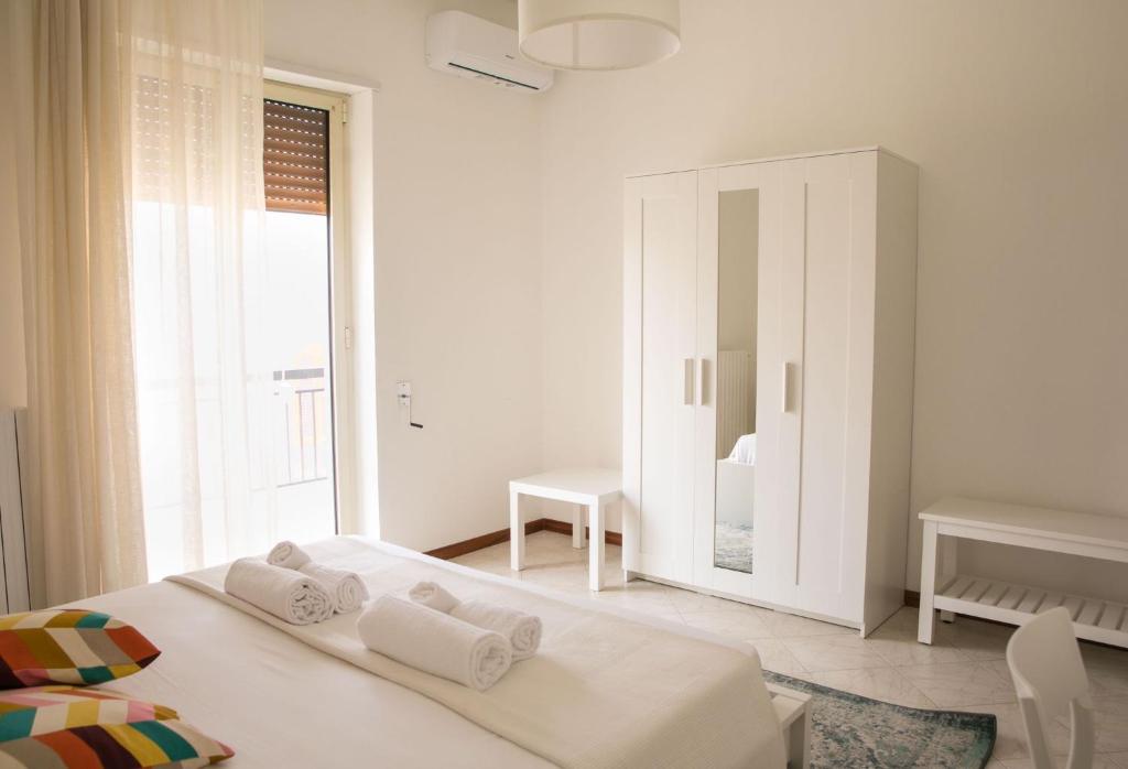 Łóżko lub łóżka w pokoju w obiekcie Cà del Mar