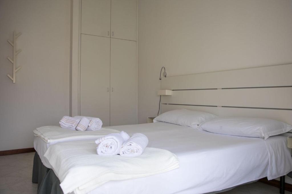 Łóżko lub łóżka w pokoju w obiekcie Cà del Mar