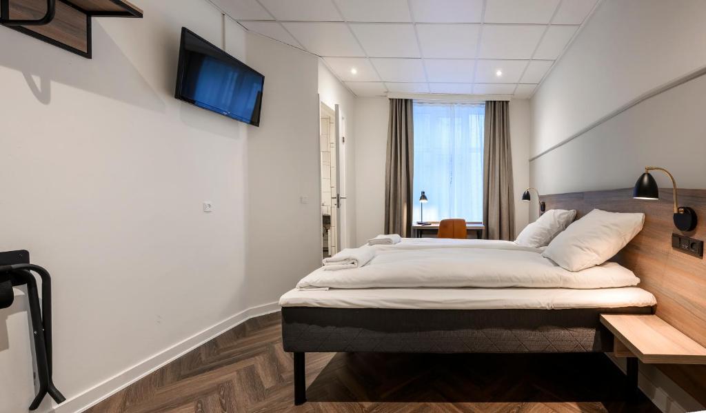 Postel nebo postele na pokoji v ubytování Go Hotel Saga