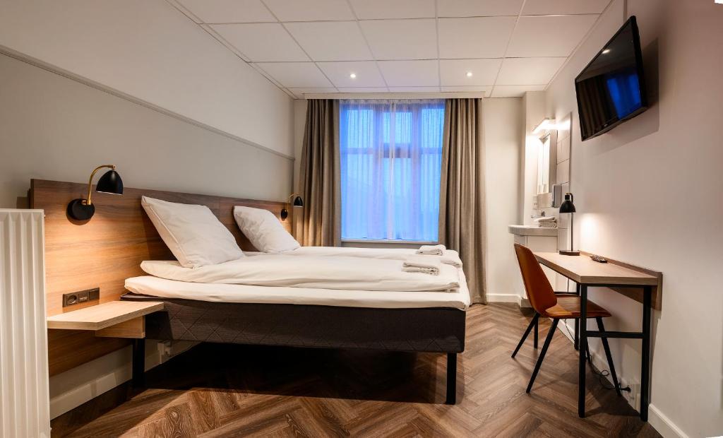 Postel nebo postele na pokoji v ubytování Go Hotel Saga