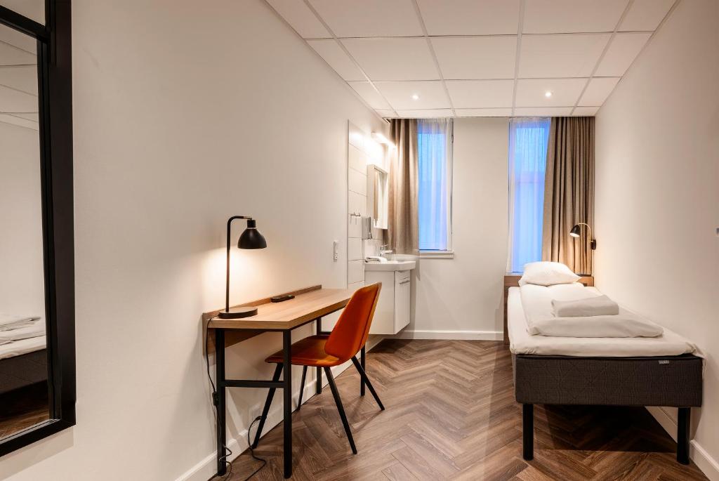 Postel nebo postele na pokoji v ubytování Go Hotel Saga