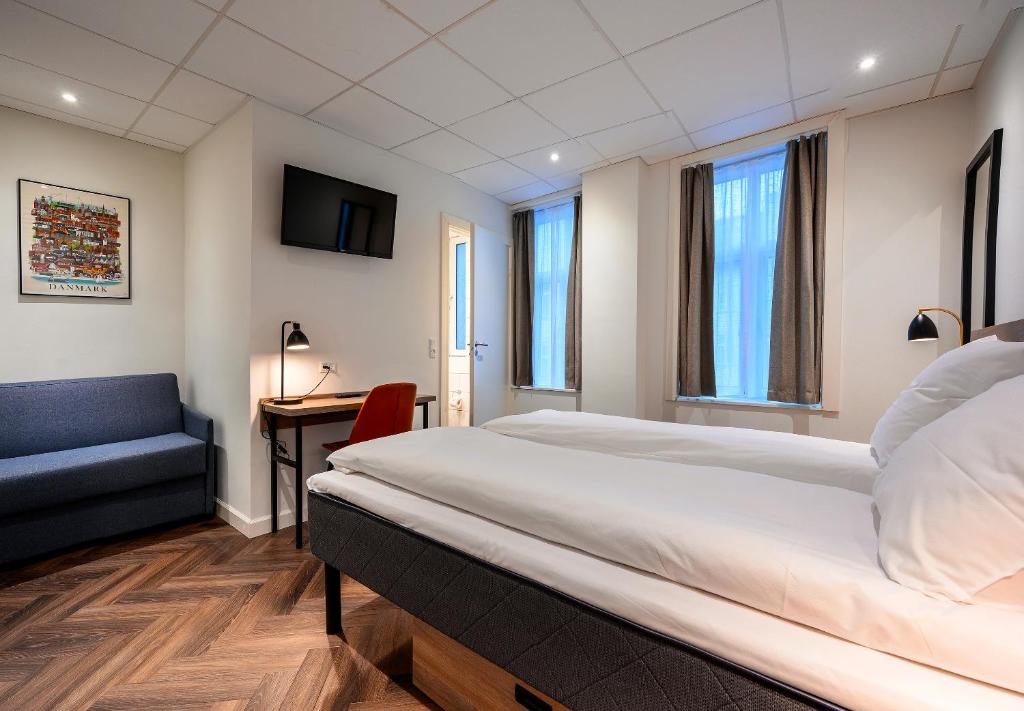 Postel nebo postele na pokoji v ubytování Go Hotel Saga