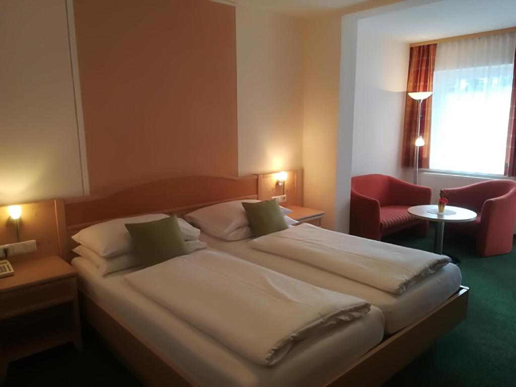 Ein Bett oder Betten in einem Zimmer der Unterkunft Landhotel-Restaurant Willingshofer