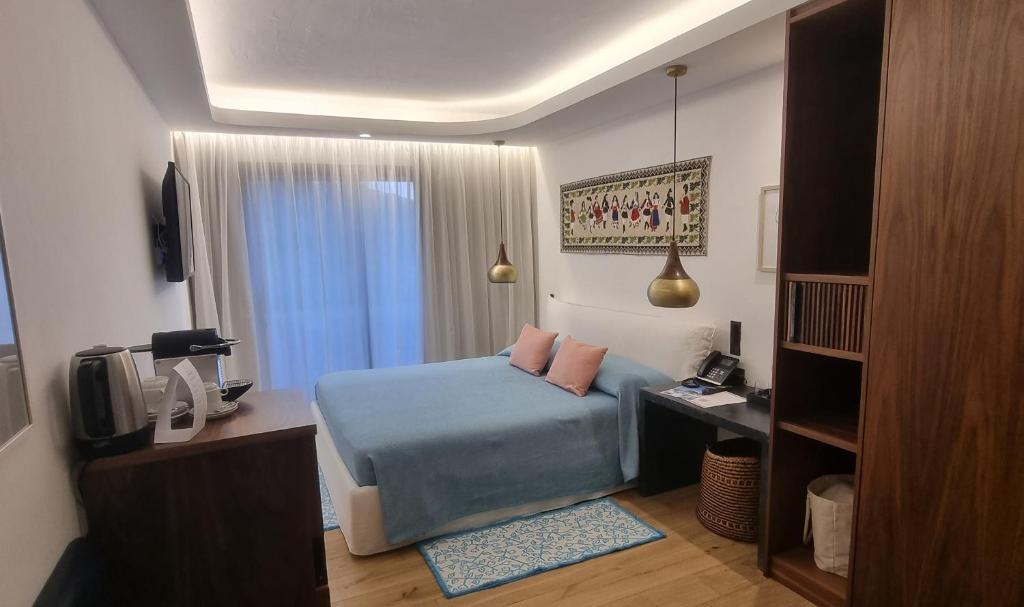 Postel nebo postele na pokoji v ubytování Hotel delle Rose a Luxury Boutique Hotel