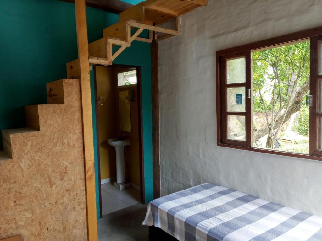 Un pat sau paturi într-o cameră la Castelinho