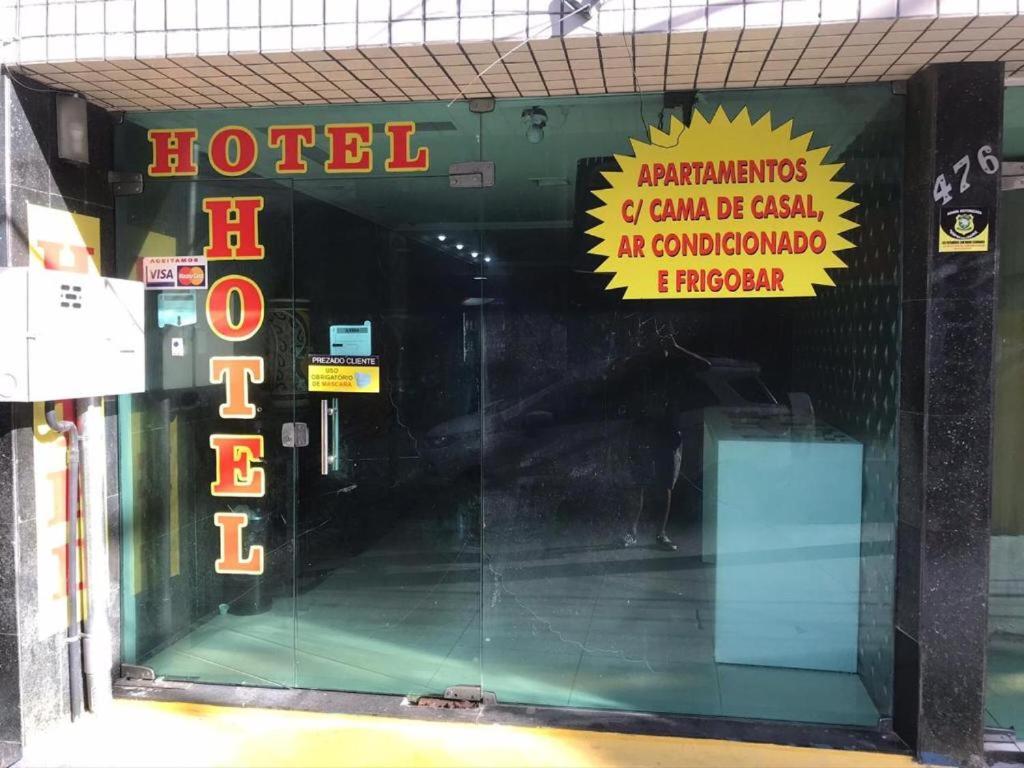 a store front with a sign on the wall at Hotel BELCENTRO in Belém