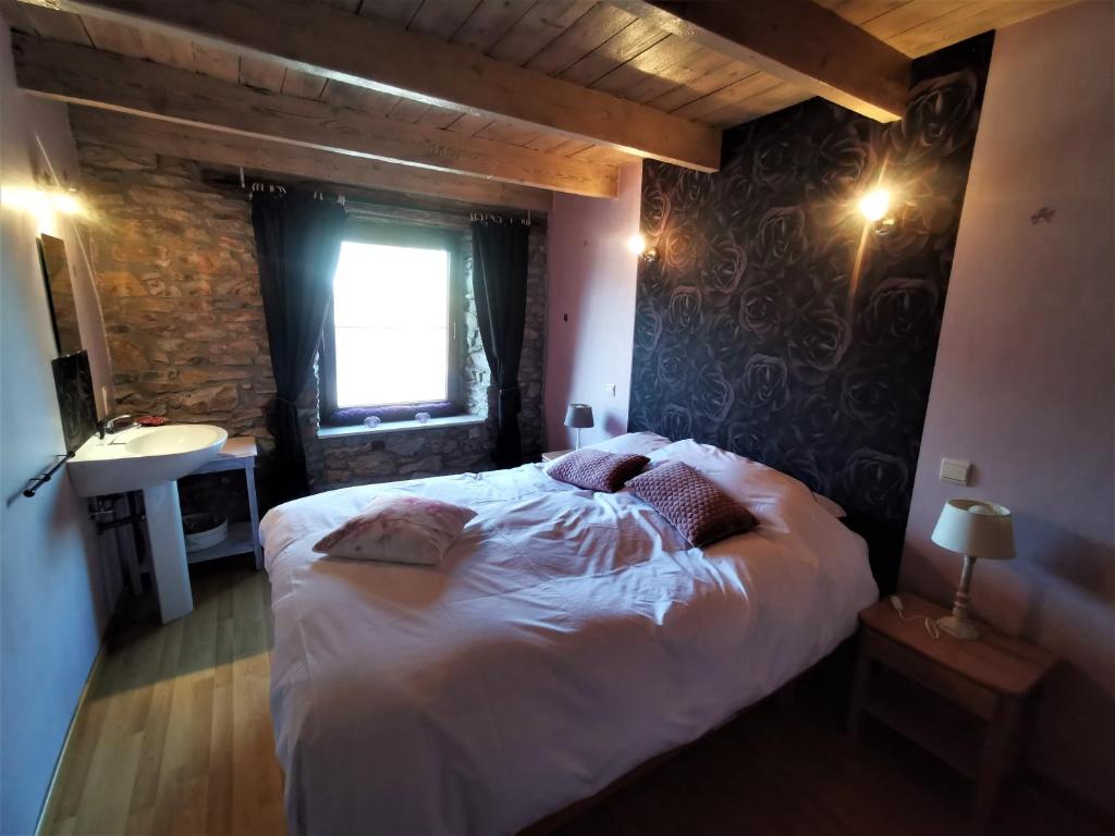Postel nebo postele na pokoji v ubytování L'Ancienne Forge - Gîte à la ferme