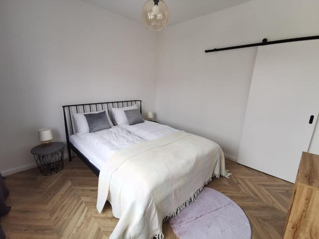 Posteľ alebo postele v izbe v ubytovaní Apartament Black&White