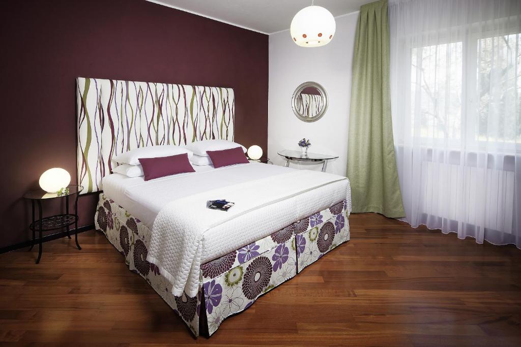 Postel nebo postele na pokoji v ubytování Villa Archi B&B