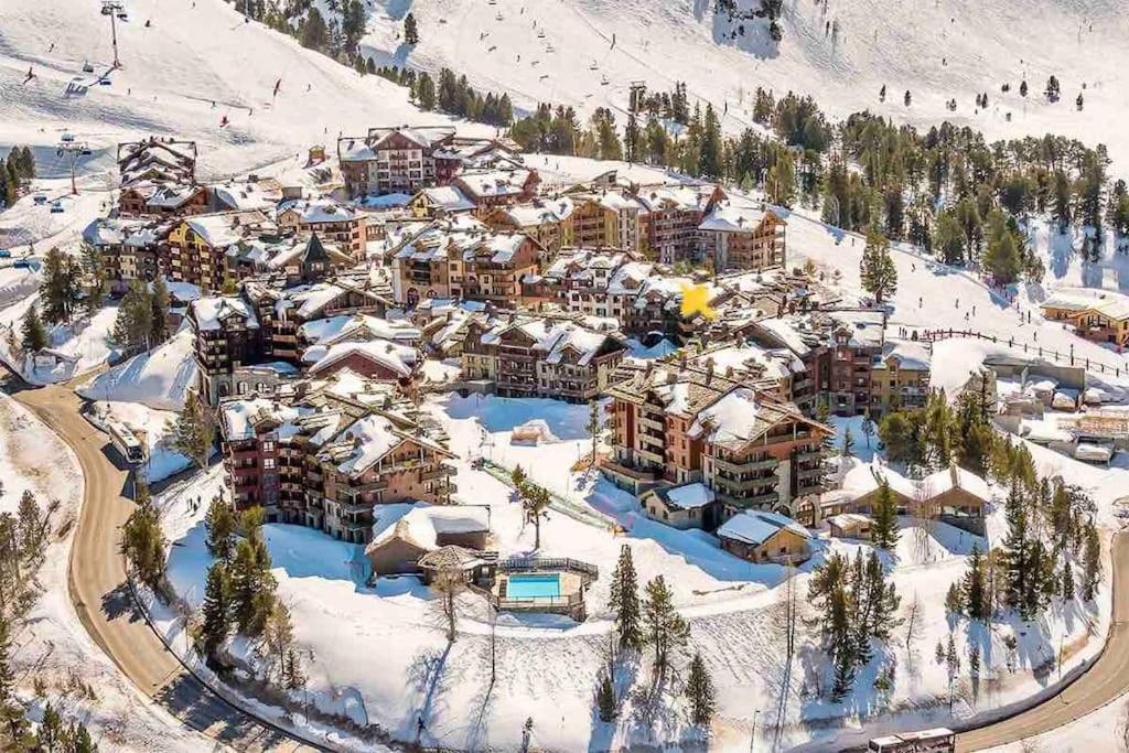 an aerial view of a resort in the snow at Superbe Appartement 6 personnes Ski-in Ski-out Arc 1950 in Bourg-Saint-Maurice