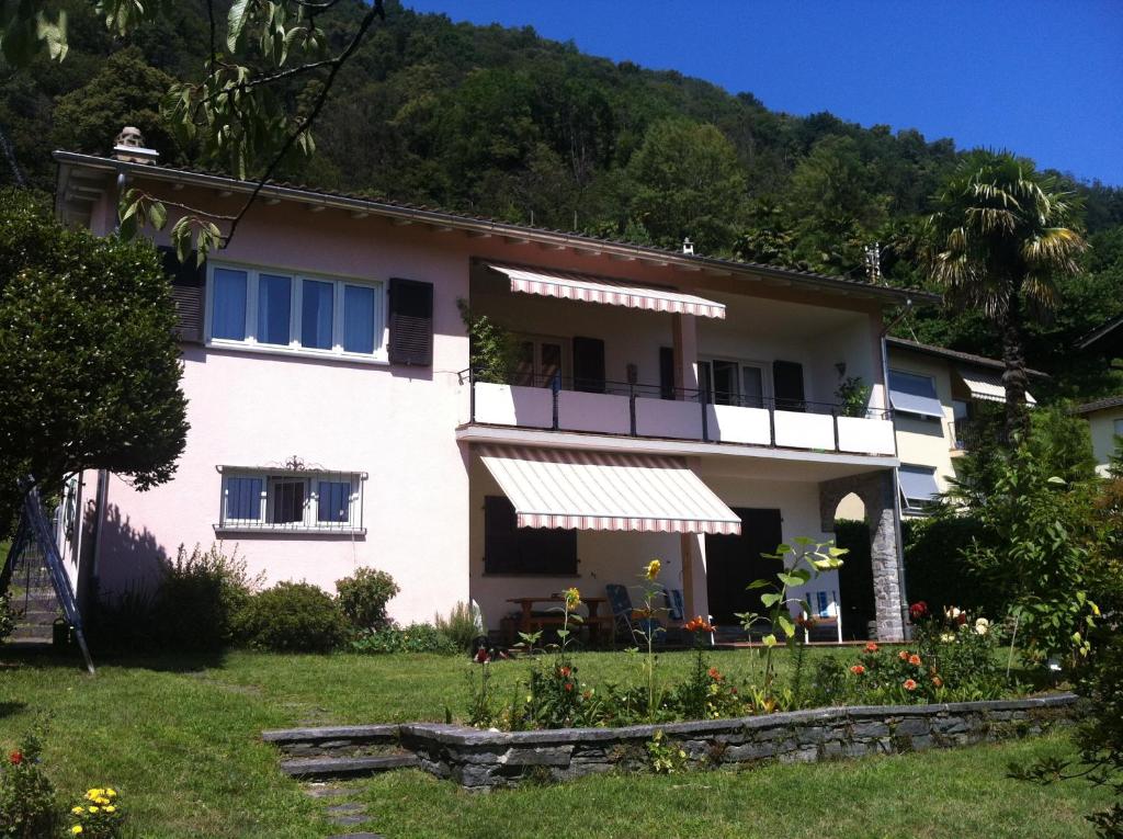 a house with a garden in front of it at Casa Alice in Locarno