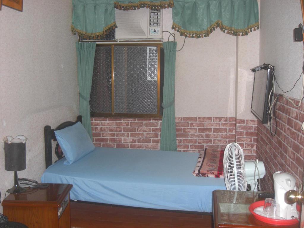 Postel nebo postele na pokoji v ubytování Uni Hotel