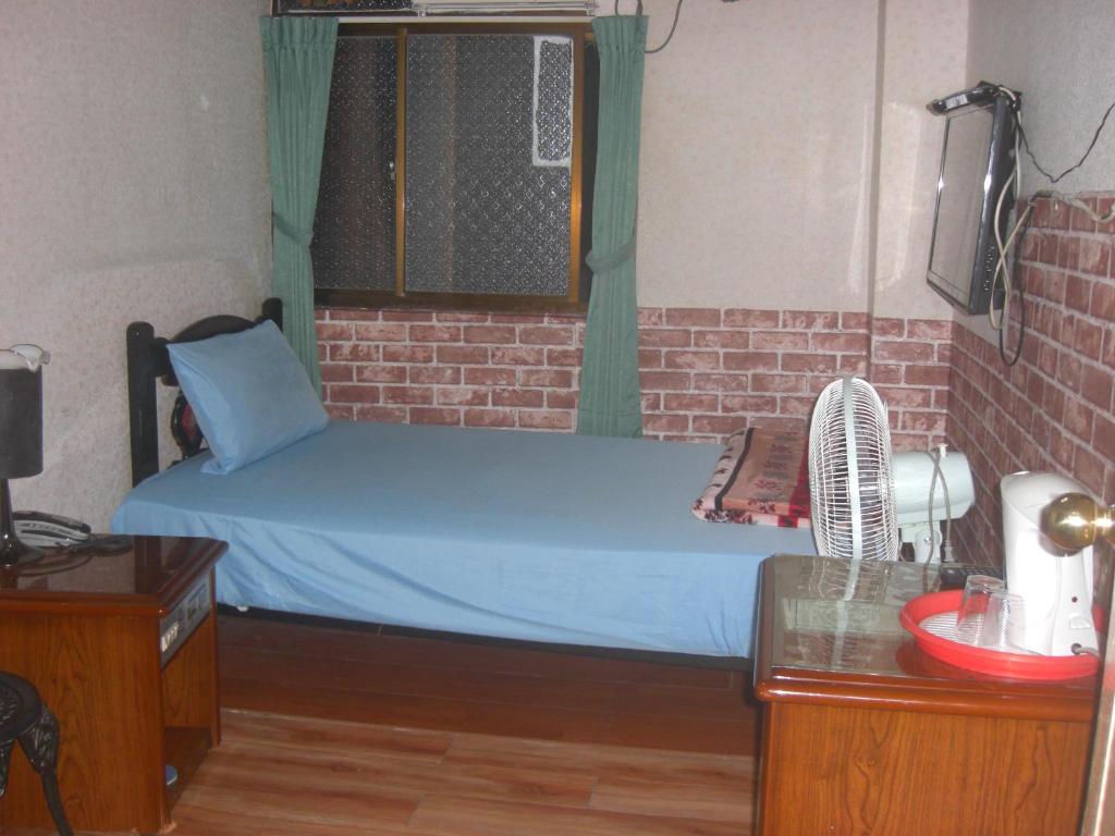 Postel nebo postele na pokoji v ubytování Uni Hotel