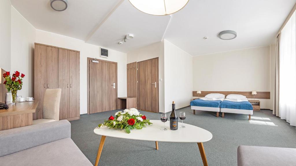 Postel nebo postele na pokoji v ubytování Hotel Zorza
