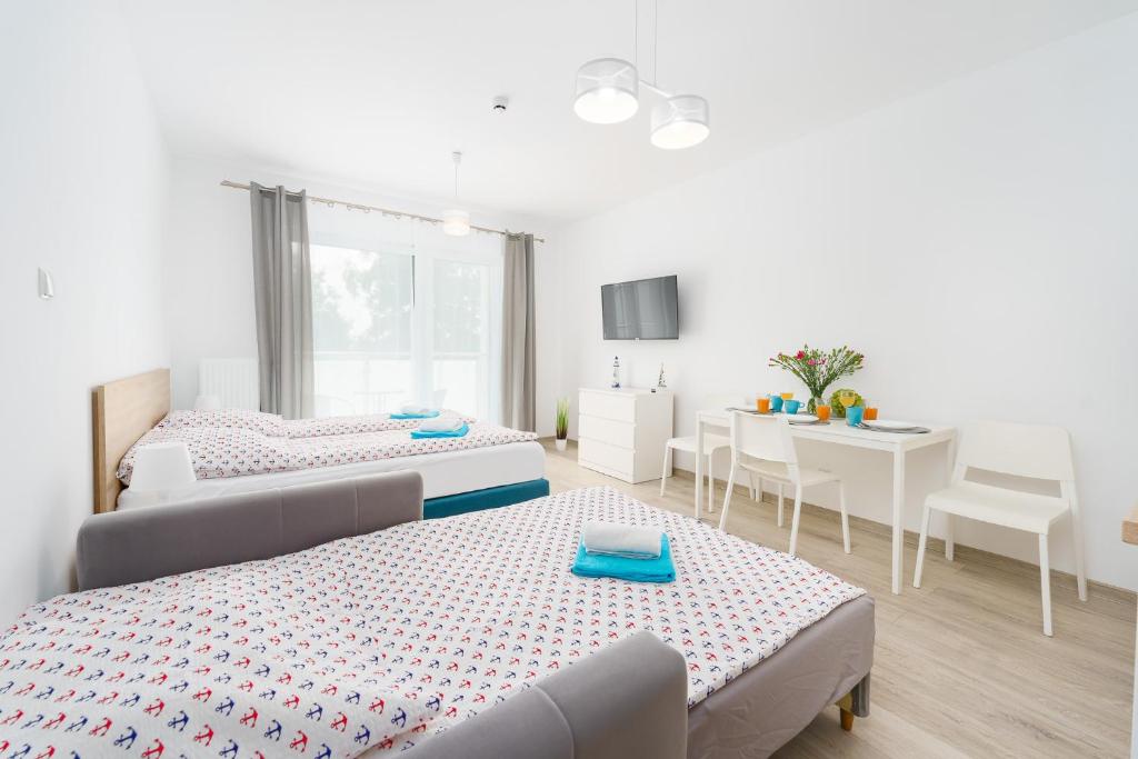 Postel nebo postele na pokoji v ubytování Apartamenty Nadmorska 104 Sunset Resort