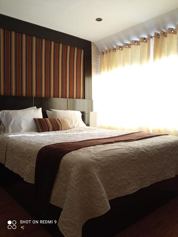 Postel nebo postele na pokoji v ubytování Monterrico Hotel Perú
