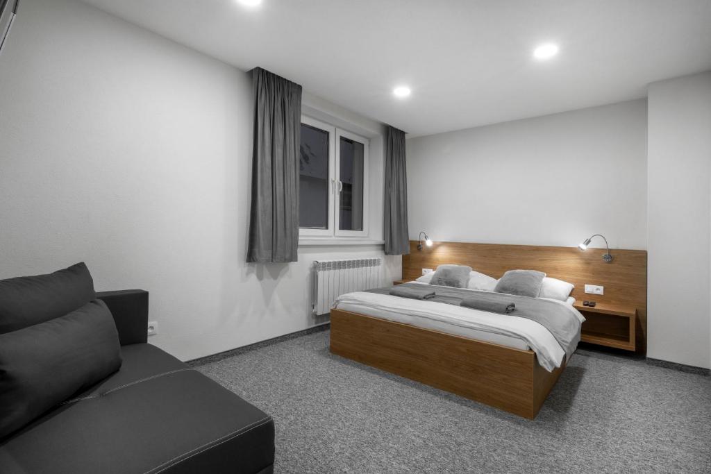 Postel nebo postele na pokoji v ubytování Apartmány Sendy