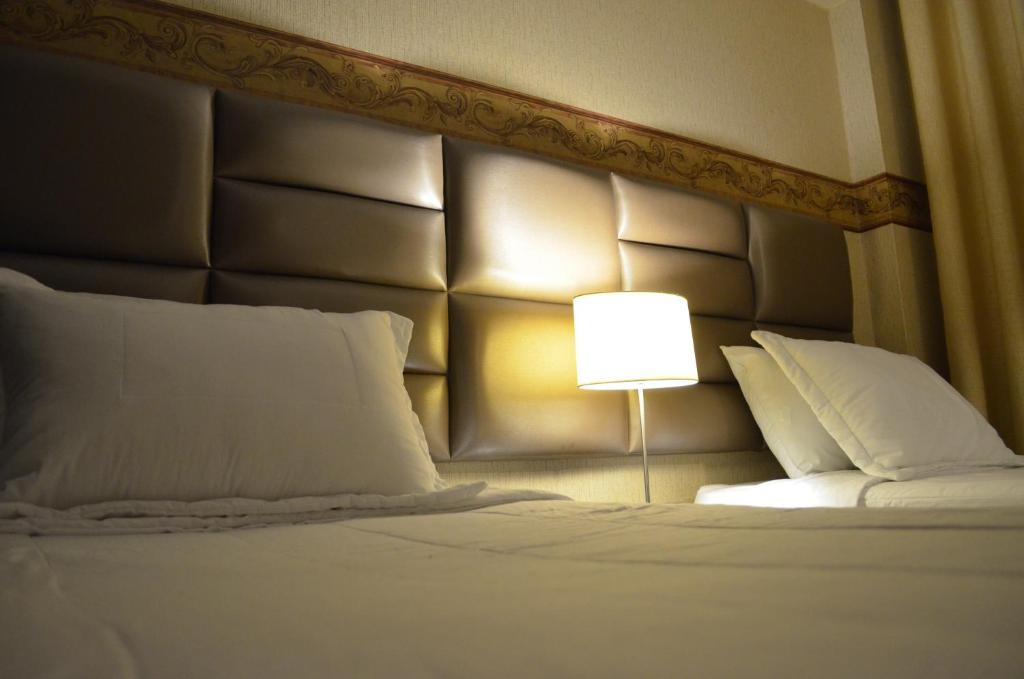 Postel nebo postele na pokoji v ubytování Monterrico Hotel Perú