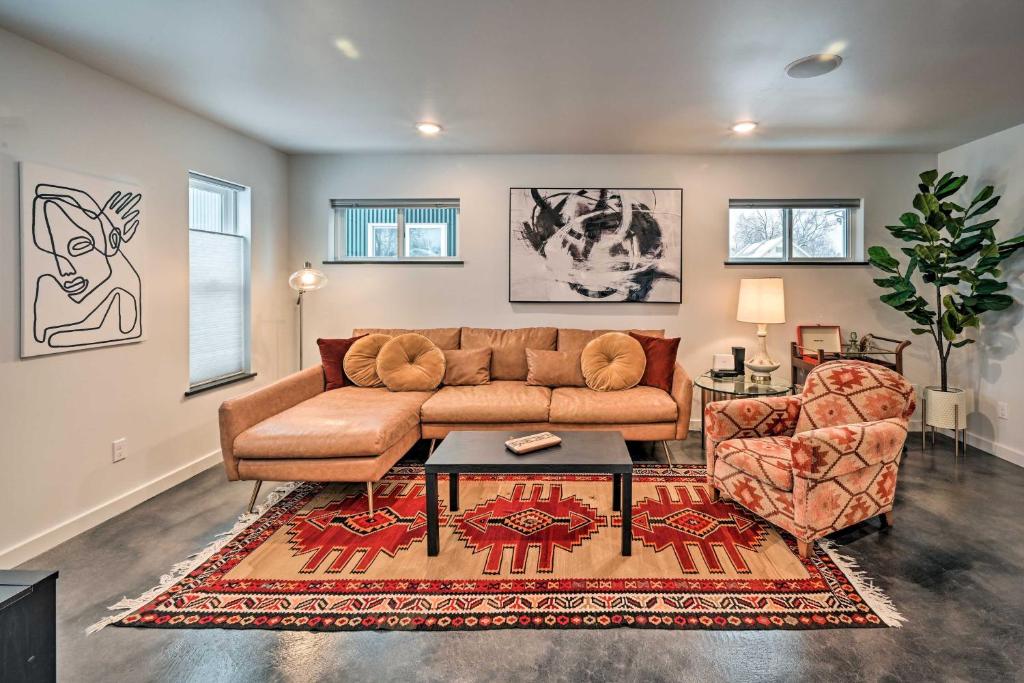 a living room with a couch and a chair at Modern Missoula Home about 2 Miles to Downtown! in Missoula