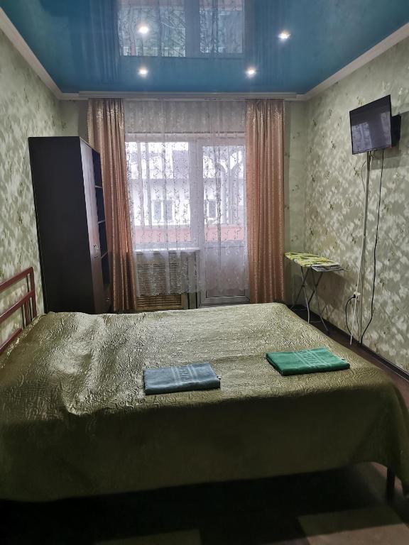 Katil atau katil-katil dalam bilik di Apartments on Kommunisticheskiy prospect 125