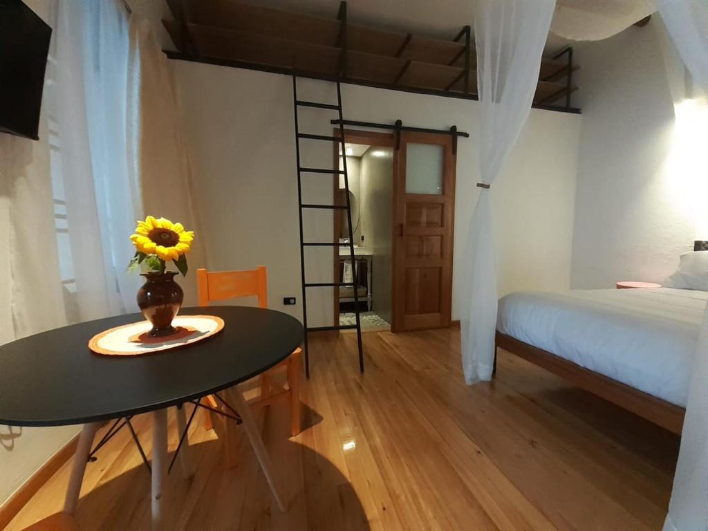 Postel nebo postele na pokoji v ubytování Hostal Suite Le Fabrique