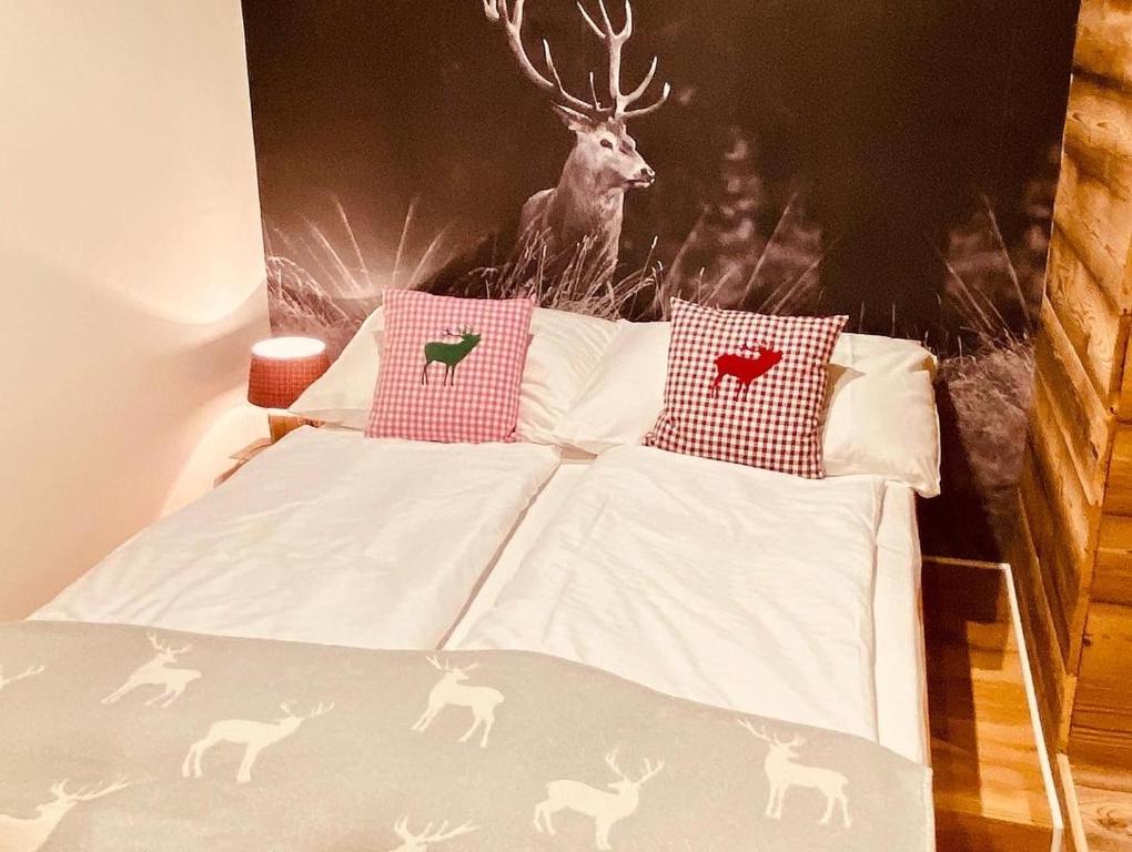Postel nebo postele na pokoji v ubytování Wilderer Suiten Mariazell