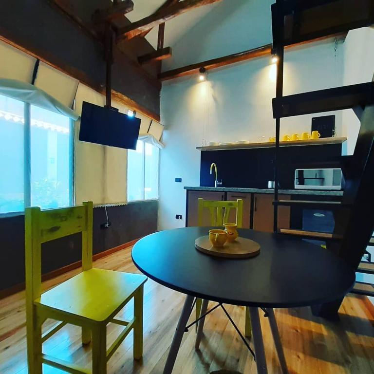 Kuchyň nebo kuchyňský kout v ubytování Hostal Suite Le Fabrique