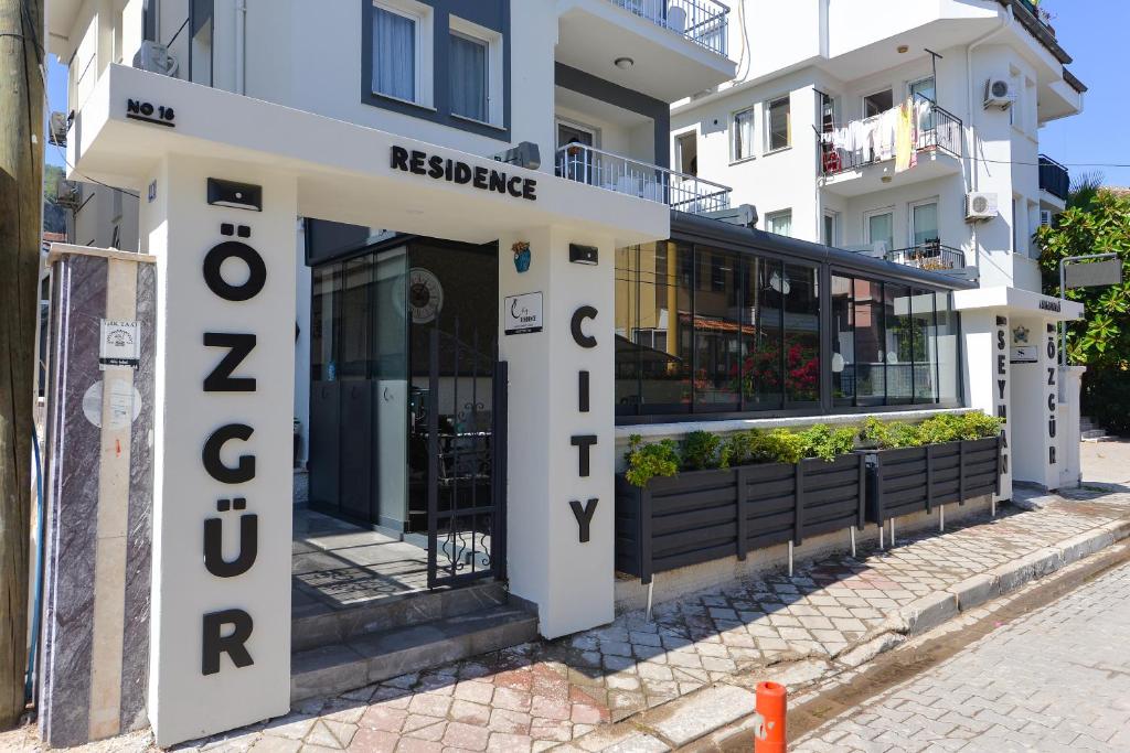 a building with a sign that says redcliffe residence at Ozgur City Residence in Fethiye