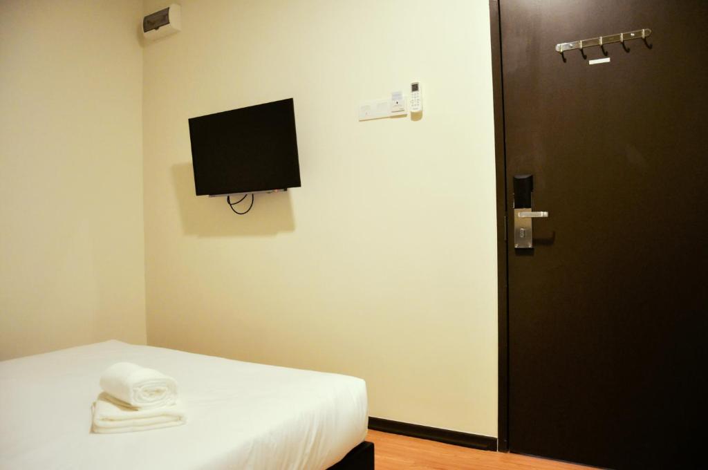 TV a/nebo společenská místnost v ubytování Gem Hotel Nusa Sentral Nusajaya