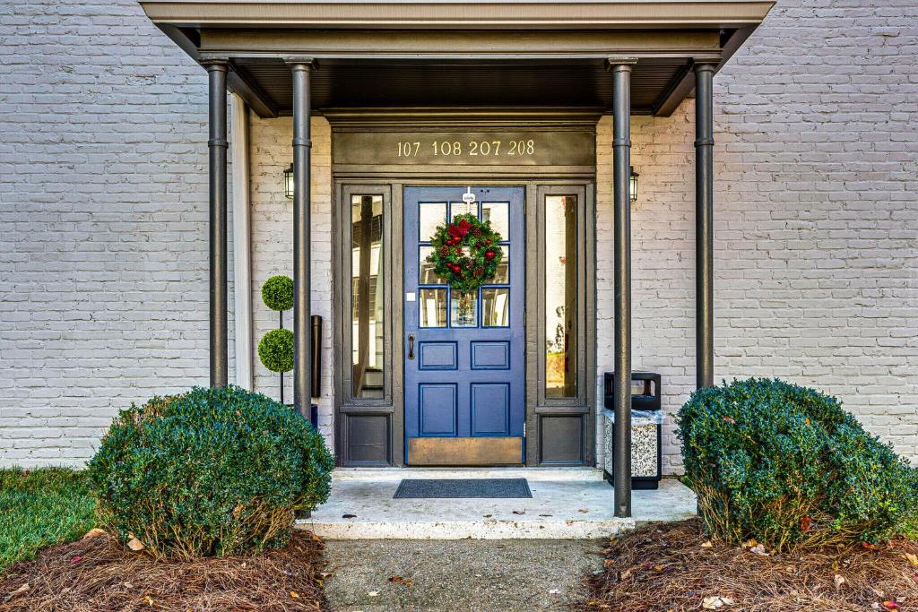 a blue door of a building with a wreath on it at Nashville Flat w/View Walkable -207 in Nashville