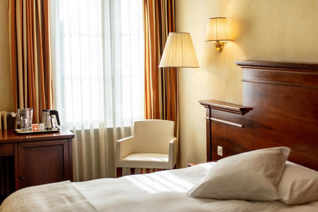 Letto o letti in una camera di Hotel Reine Victoria