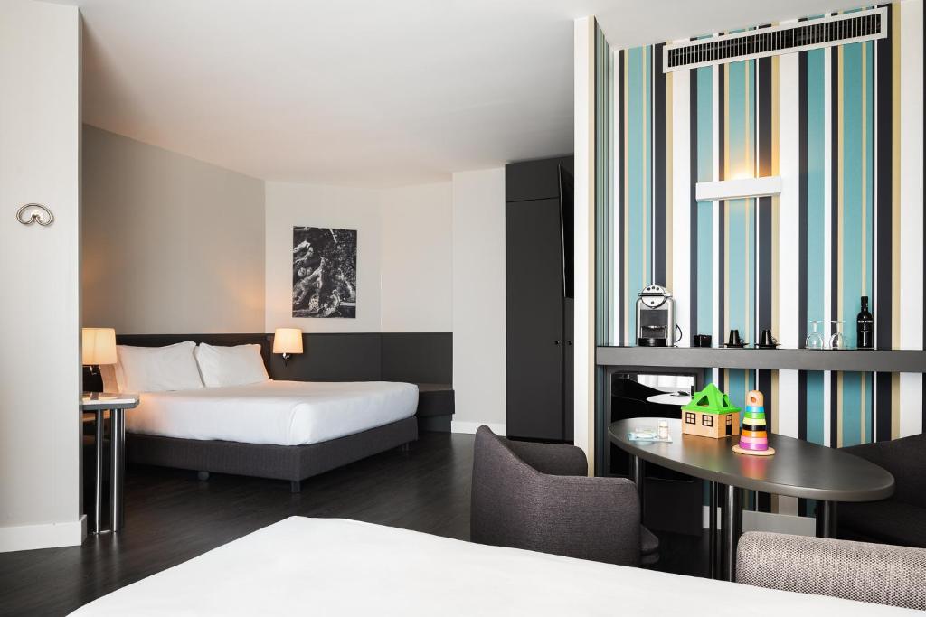 Кровать или кровати в номере The Nicolaus Hotel