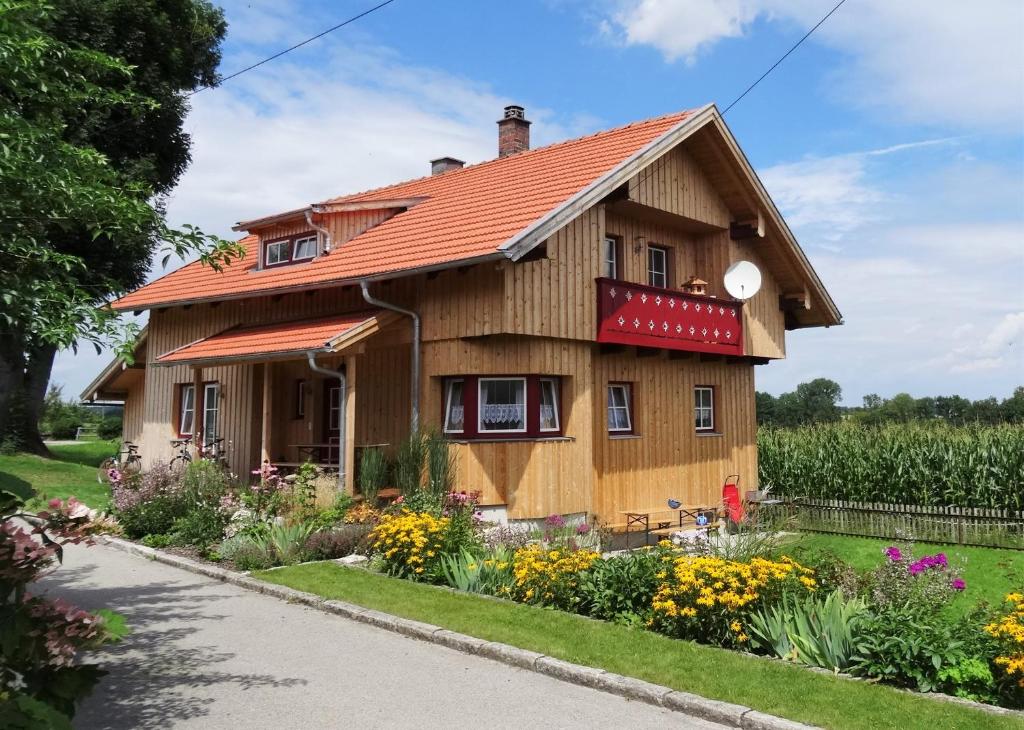 a house with a garden in front of it at Ferienhaus Wankner in Tittmoning