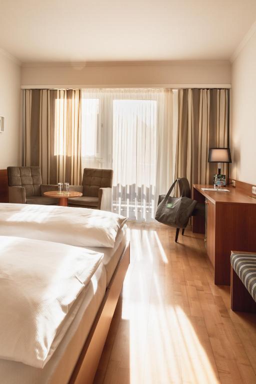 Postel nebo postele na pokoji v ubytování Vulkanlandhotel Legenstein