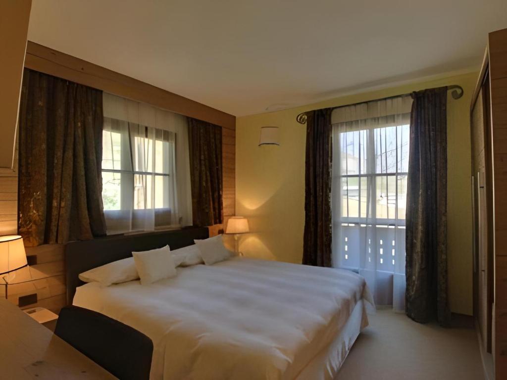 Postel nebo postele na pokoji v ubytování Hotel Bait de Angial