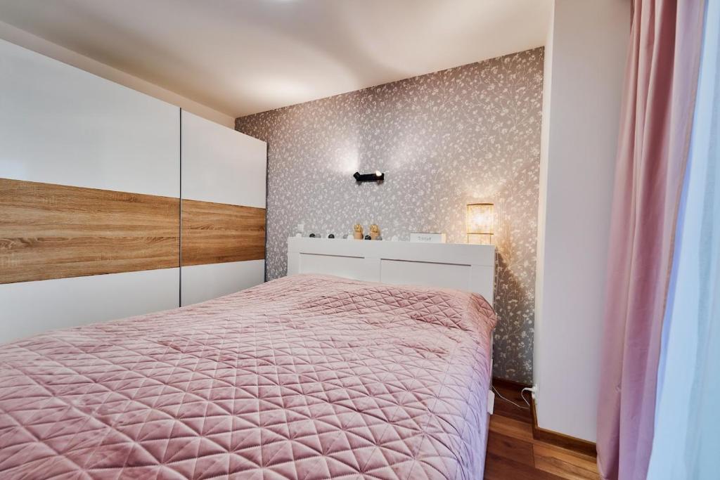 Posteľ alebo postele v izbe v ubytovaní LAGUNA Apartament Polanica Residence 48
