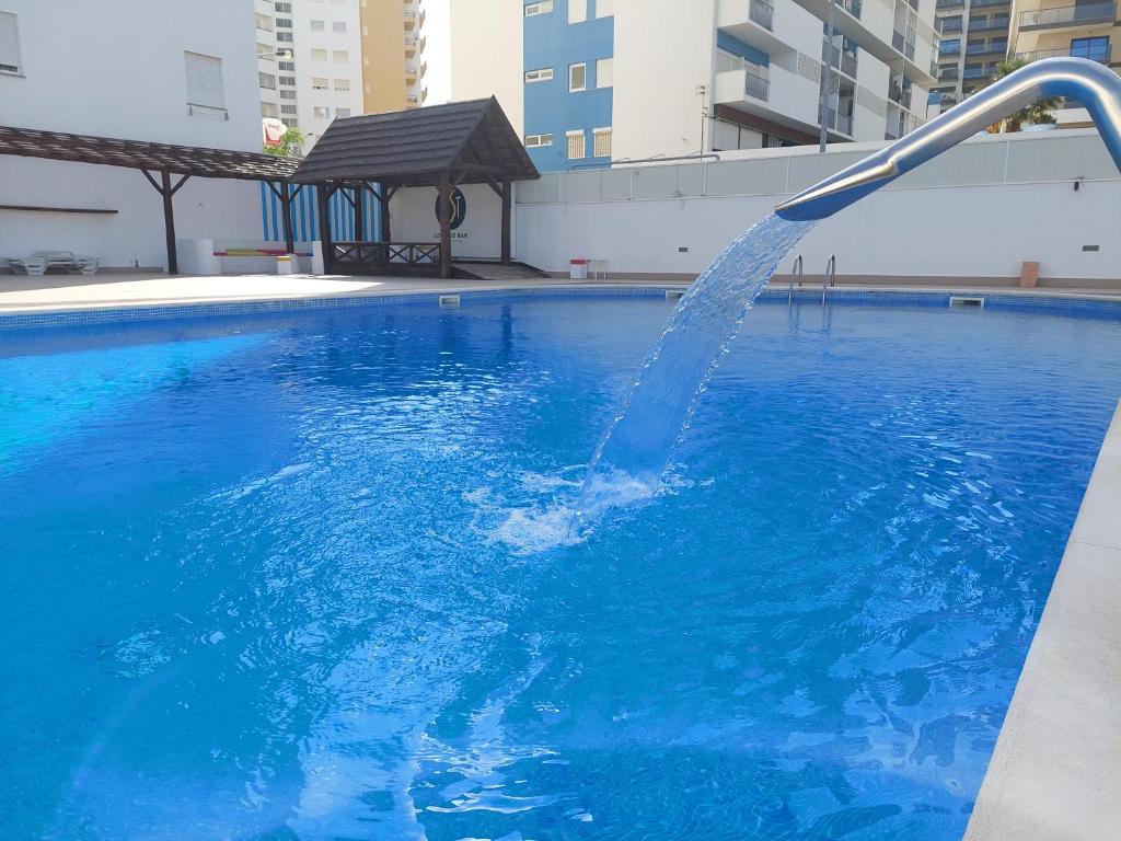 a water fountain in a swimming pool at Alltravel Gaivota Mar in Portimão