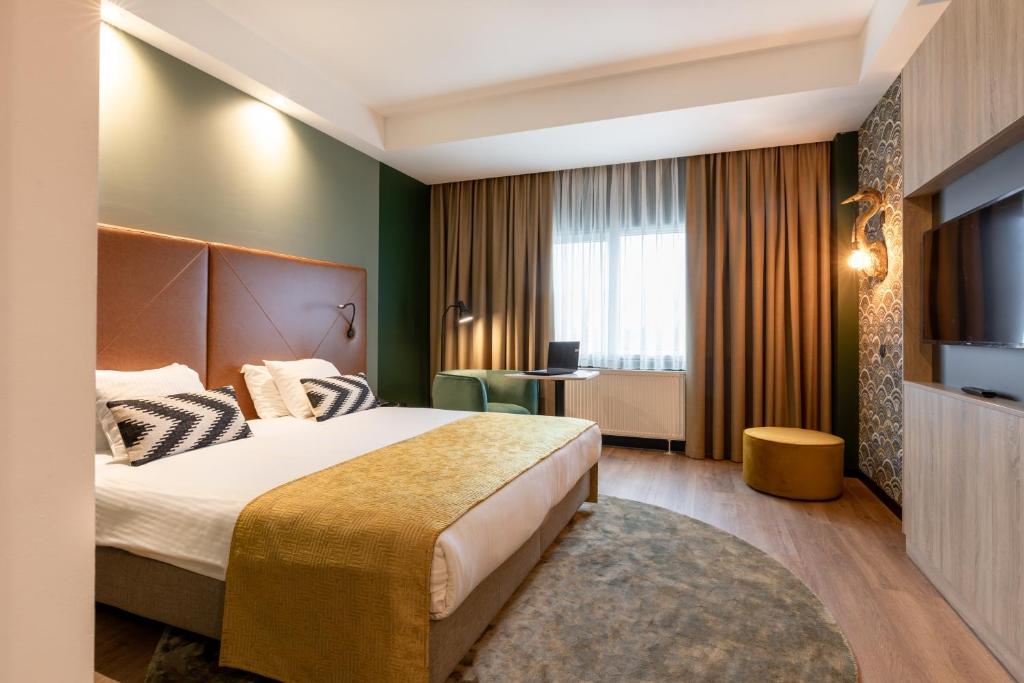 Кровать или кровати в номере Shanghai Hotel Holland