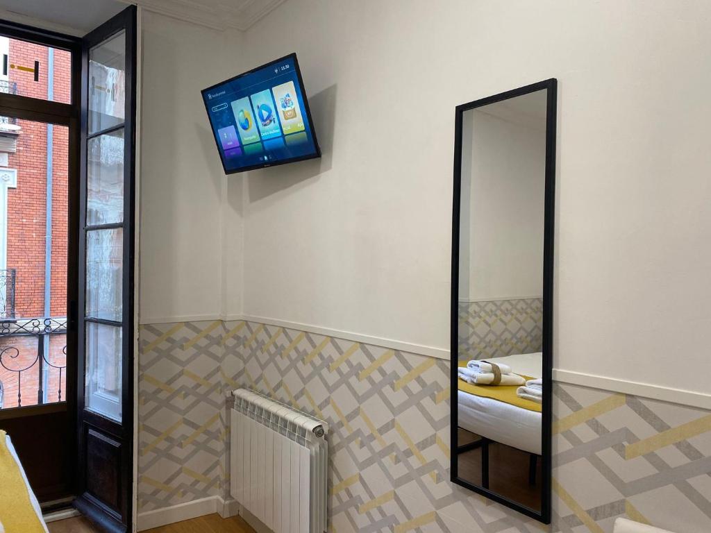 TV a/nebo společenská místnost v ubytování INSIDEHOME Valladolid Centro -Hab con baño privado en el centro y OPCION DE PARKING-