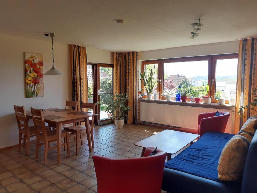 a living room with a couch and a table and chairs at Haus Irene mit Terrasse in Salem