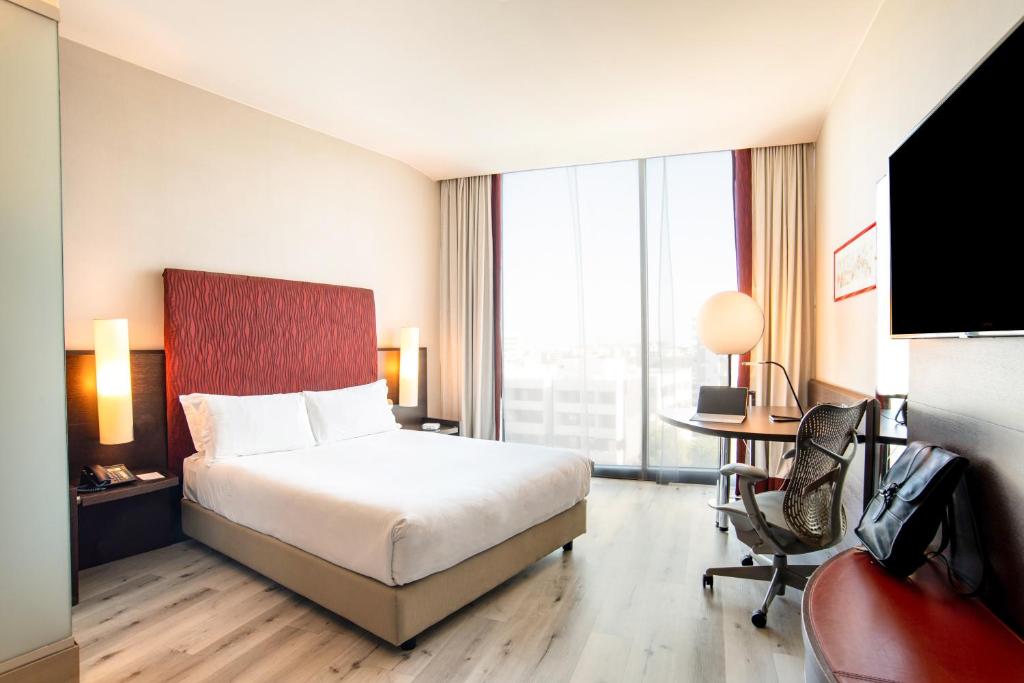 A bed or beds in a room at Hi Hotel Bari