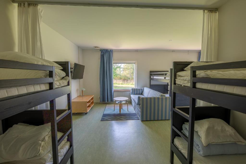 Postel nebo postele na pokoji v ubytování Systemairhallen Bed&Breakfast
