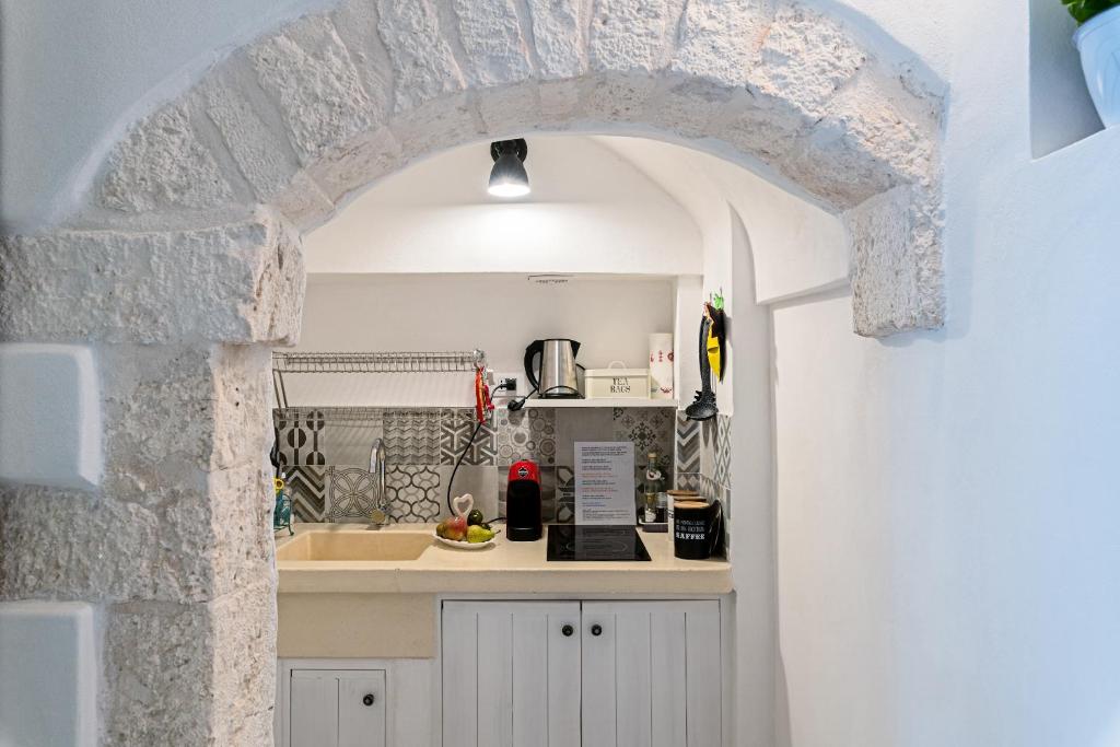 Una cocina o zona de cocina en Le Piccole Case Bianche