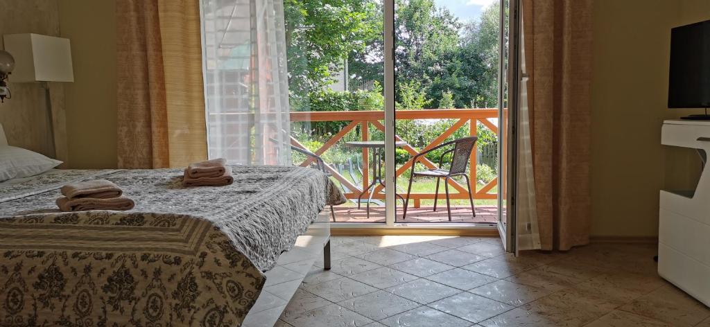 Postel nebo postele na pokoji v ubytování Green Gile Villa in Druskininkai Center