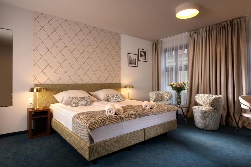 Posteľ alebo postele v izbe v ubytovaní Xerion Hotel