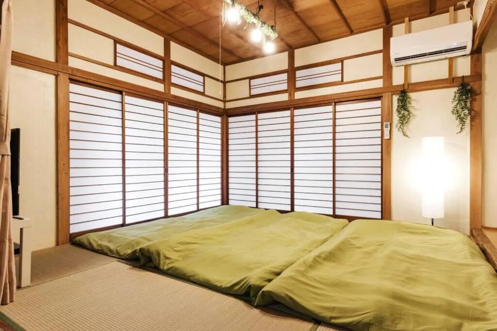 Postel nebo postele na pokoji v ubytování Forest Villa Hakone
