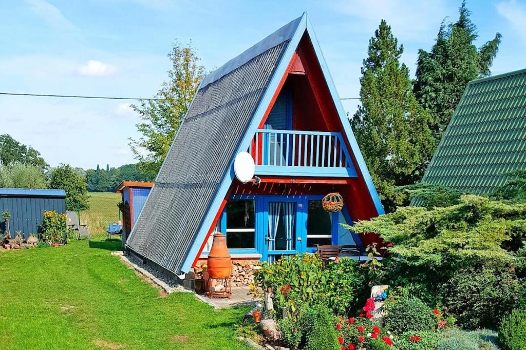 a small house with a gambrel roof at Cottage, Perlin in Perlin