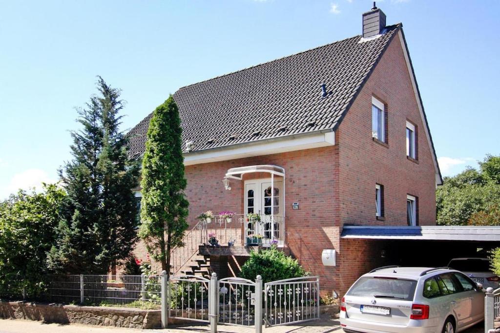 a house with a car parked in front of it at Ferienwohnung in Dassow in Dassow