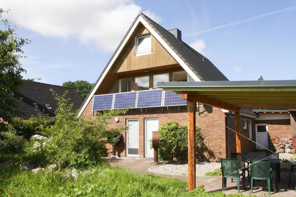 a house with solar panels on the roof at Vacation home, Neukirchen in Neukirchen